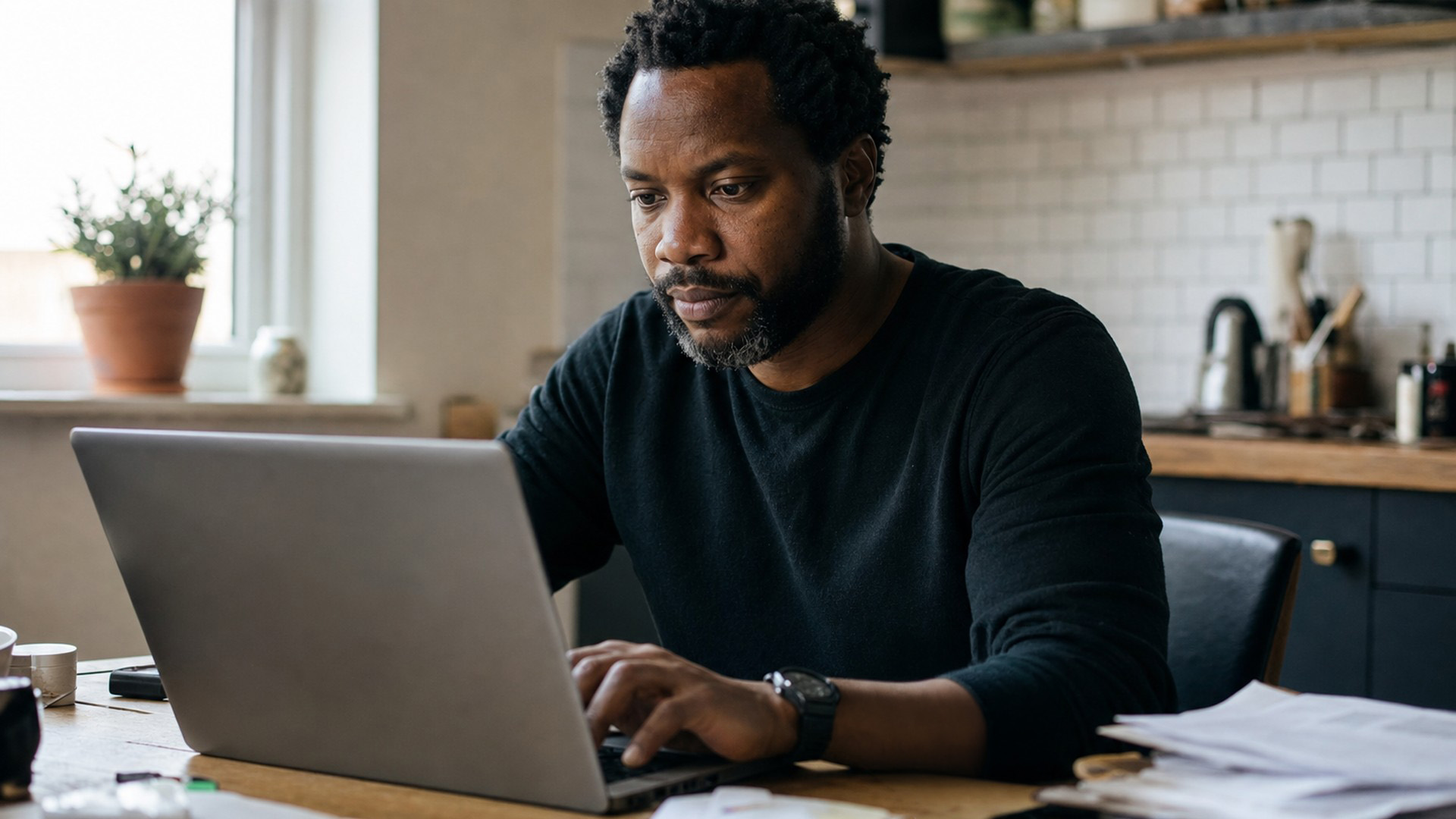 A freelancer typing a short scope note to a client after a new stakeholder joined a project thread
